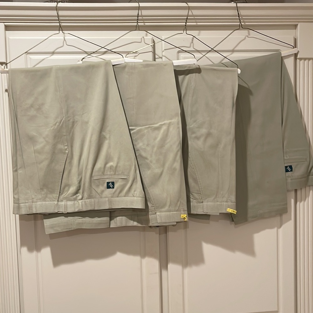 Four pairs of men relaxed fit khaki colored pants 44”X32” adjustable waist $110